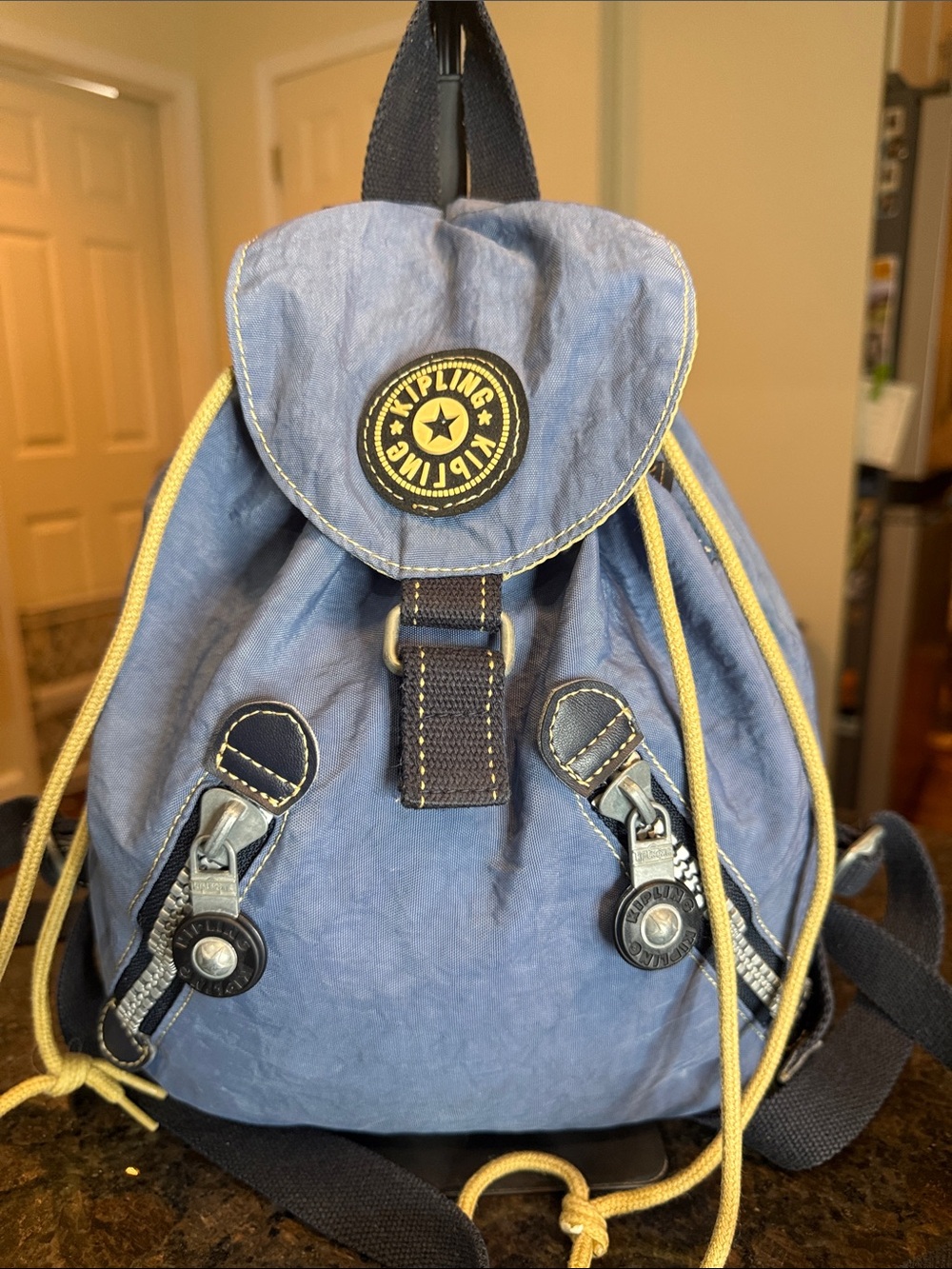 Vintage Kipling Light Blue Backpack with Yellow Drawstrings